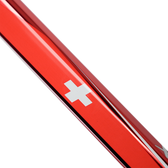 Close-up of a red metal object with a white cross emblem on a white background
