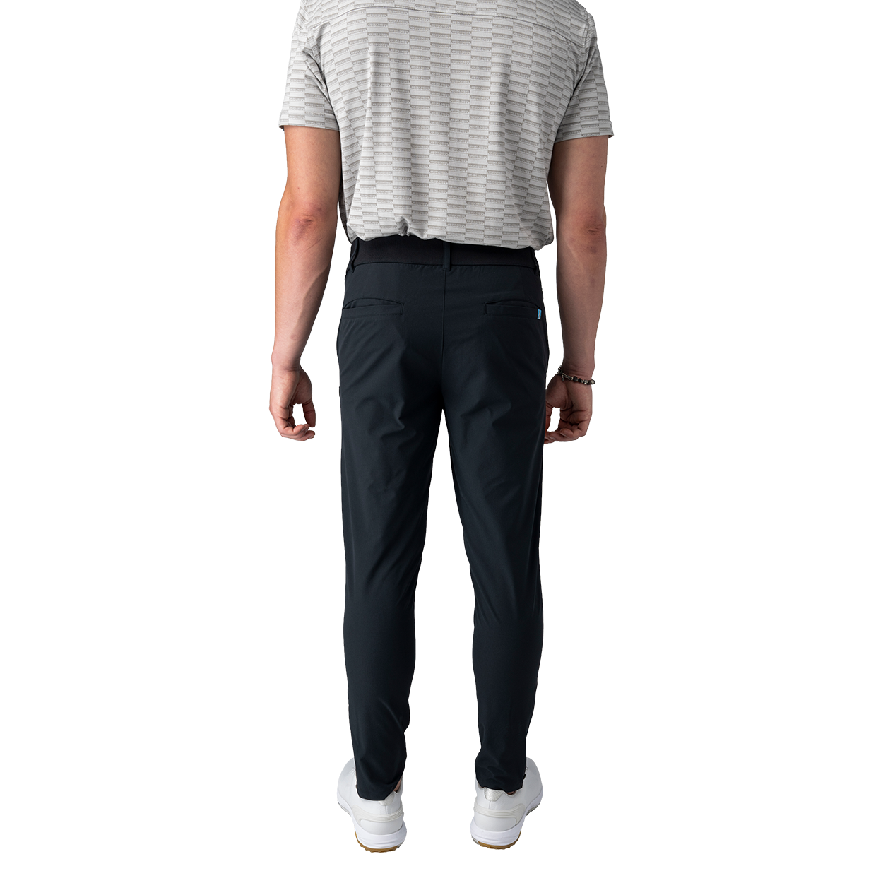 Person wearing black pants and a striped shirt on a white background